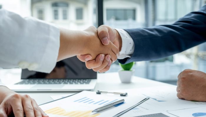 Photo of business partners shaking hands.